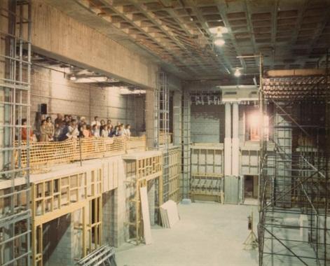 Untitled (visitors inside building under construction)